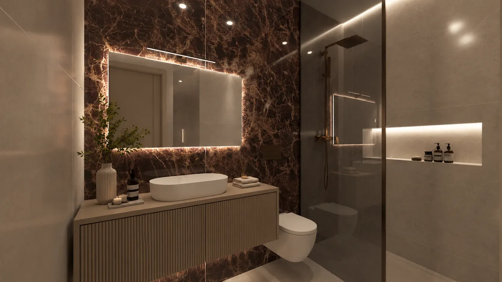 Bagno con rivestimento scuro, specchio luminoso e lavabo d’appoggio